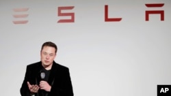 FILE - Elon Musk, CEO of Tesla Motors Inc., talks during a news conference at the company's headquarters in Fremont, California, Sept. 29, 2015.