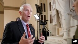 FILE - Rep. Mo Brooks, R-Ala., a member of the conservative Freedom Caucus, is interviewed on Capitol Hill in Washington.