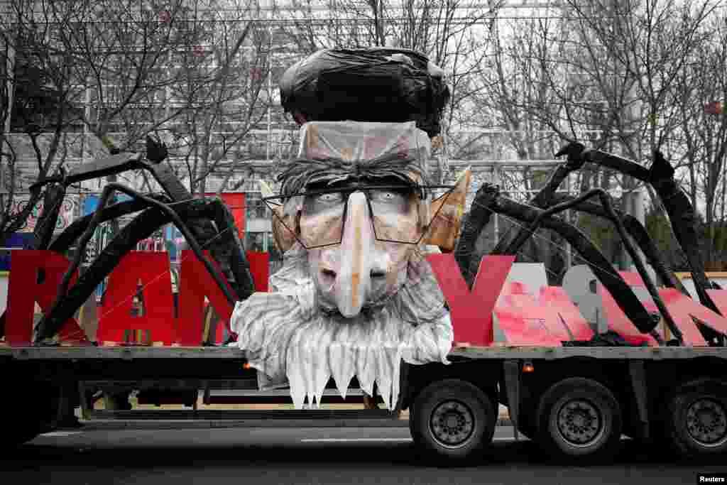 A truck with the likeness of Iran&#39;s late leader Ayatollah Ruhollah Khomeini is pictured as thousands of Iranian opponents in exile protest against the Teheran regime, days before the 40th anniversary of the Iranian Islamic Revolution, in Paris, France.