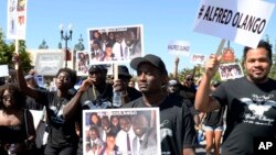 Protesters march through downtown El Cajon, Calif., Oct. 1, 2016, in reaction to the fatal police shooting of unarmed black man, Alfred Olango. Olango was a Ugandan refugee who arrived in the U.S. as a boy. 