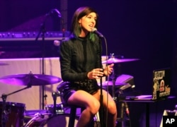 FILE - Christina Grimmie performs as the opener for Rachel Platten at Center Stage Theater, in Atlanta, March 2, 2016. Grimmie was shot by a gunman as she signed autographs for fans after a show, killing the onetime star of "The Voice" late Friday.