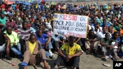 Striking Lonmin Platinum miners gather in Marikana, South Africa, where a new wage offer was rejected, Sept. 14, 2012. 