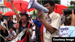 FILE - People rally to raise awareness of human rights abuses in Cambodia in 2012.
