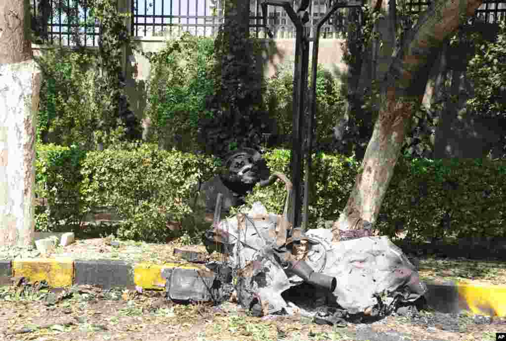 Twin blasts targeting Syria&#39;s army command headquarters rocked the capital on Sept. 26, setting off hours of sporadic gunbattles and a raging fire inside the heavily guarded compound, state-run media and witnesses said.