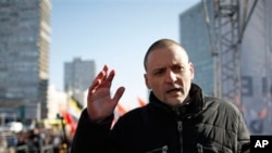 Opposition leader Sergei Udaltsov speaks during an opposition rally in Moscow, Russia, Saturday, March 10, 2012.