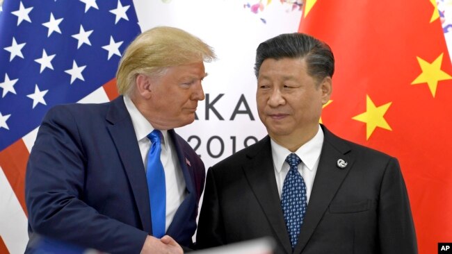资料图片。美国总统特朗普和中国国家主席习近平2019年6月日本举行会晤。