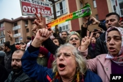 People gather outside Bakirkoy courthouse in Istanbul, Jan. 12, 2018, in support of the jailed co-chair of the Peoples' Democratic Party (HDP).