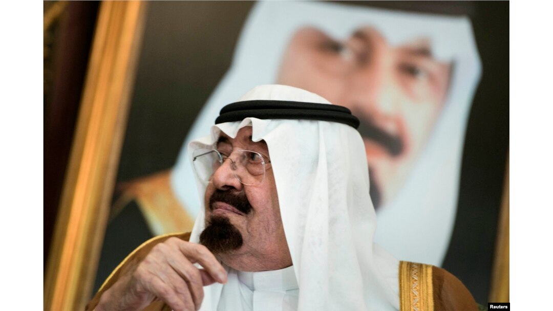 FILE - Saudi King Abdullah bin Abdul Aziz al-Saud sits before a meeting with U.S. Secretary of State John Kerry at the Royal Palace, Jeddah, Sept. 11, 2014.