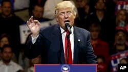 FILE - President-elect Donald Trump gestures as he speaks during a "USA Thank You" tour event in Cincinnati, Dec. 1, 2016.