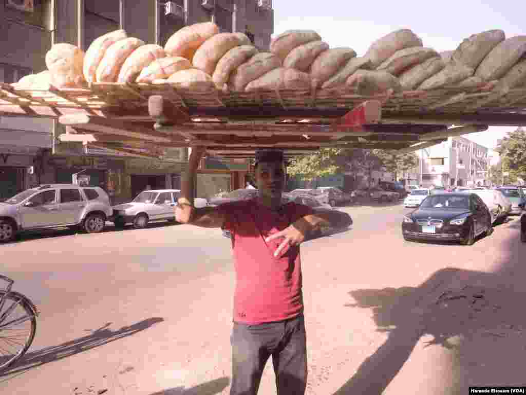 Sameh Soltan, a bread vendor: In Egyptian Arabic, &ldquo;bread&rdquo; and &ldquo;life&rdquo; are the same word. &ldquo;I feel bad for the customers because prices are going up.&quot; Soltan sells bread in the Cairo suburbs. He learned how to balance the bread on his head from his brother and they carry the bread without vehicles because the cost of transportation would further raise prices in their already poor community. &ldquo;It looks like I work in circus and it&#39;s fun. But no it&#39;s really tiring job. Everyday I go back home sleep like I&rsquo;m dead.&quot;