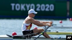 Peter Purcell-Gilpin, of Zimbabwe, competes in the men's single scull repechage at the 2020 Summer Olympics, Saturday, July 24, 2021, in Tokyo, Japan. (AP Photo/Darron Cummings)