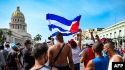 Cubans are seen outside Havana's Capitol during a demonstration against the government of Cuban President Miguel Diaz-Canel in Havana, on July 11, 2021. 