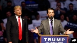 Donald Trump Jr. speaks as Republican presidential candidate Donald Trump listens during a campaign stop in Indianapolis, April 27, 2016.