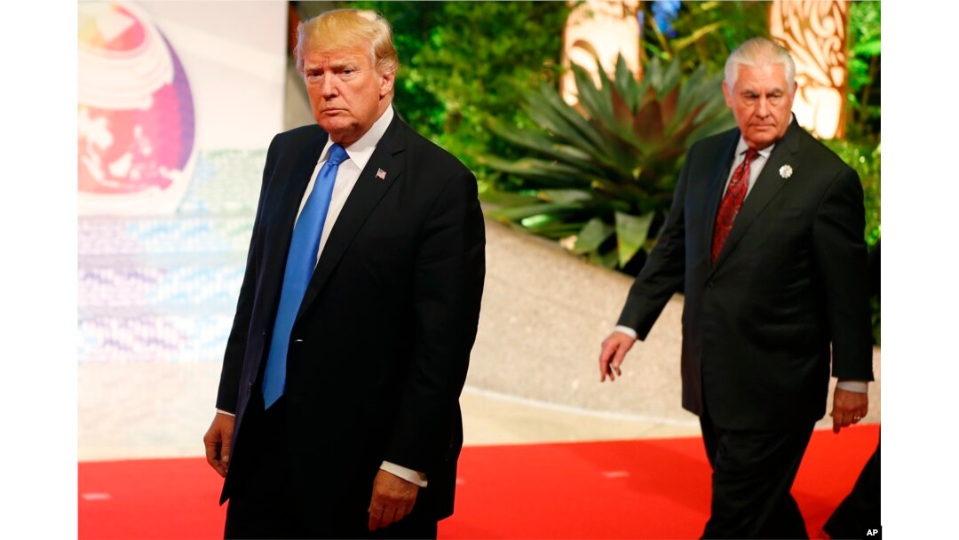 FILE - President Donald Trump, followed by Secretary of State Rex Tillerson, is pictured in Manila, Philippines, site of an ASEAN summit, Nov. 14, 2017.