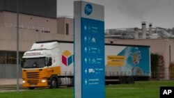 A truck leaves Pfizer Manufacturing in Puurs, Belgium, on Wednesday, Dec. 2, 2020. British officials authorized a COVID-19 vaccine for emergency use on Wednesday. (AP Photo/Virginia Mayo) 