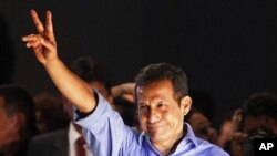 Presidential candidate Ollanta Humala gestures to supporters after the presidential runoff election in Lima, Peru, June 5, 2011.