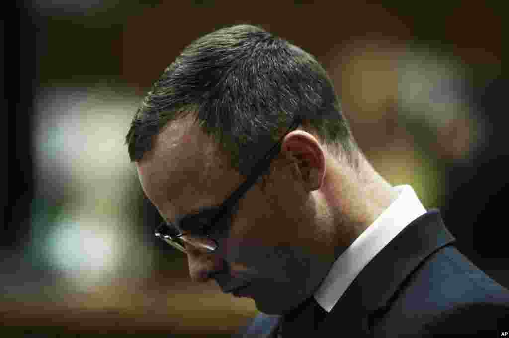 Oscar Pistorius stands in the dock in court in Pretoria, South Africa, May 14, 2014. 