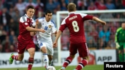 Armenia's Henrik Mkhitaryan (2nd L) fights for the ball with Denmark's William Kvist (L) and Christian Eriksen during their 2014 World Cup qualifying soccer match in Copenhagen June 11, 2013. REUTERS/Jens Noergaard Larsen/Scanpix Denmark (DENMARK - Tags: 