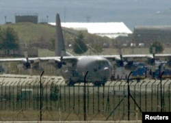 FILE - A U.S. Air Force C-130 transport plane is seen at a Turkish airbase. The U.S. military has been dropping supplies to rebels fighting Islamic State militants in northern Syria.