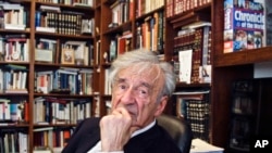 FILE - In this Sept. 12, 2012, photo Elie Wiesel is photographed in his office in New York. Wiesel, the Nobel laureate and Holocaust survivor has died. His death was announced Saturday, July 2, 2016 by Israel's Yad Vashem Holocaust Memorial.