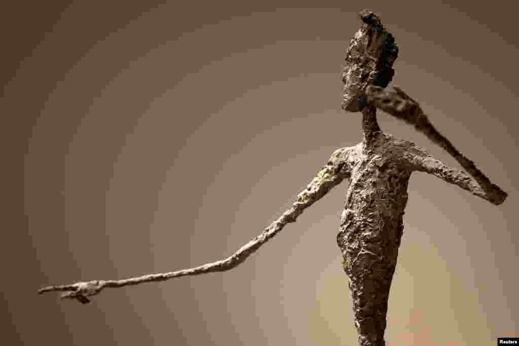 The top half of Alberto Giacometti&#39;s (Pointing Man) sculpture is pictured at Christie&#39;s Auction House in the Manhattan, New York. The Giacometti sculpture set a world record price of $141.3 million.