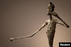 The top half of Alberto Giacometti's "L'homme Au Doigt" (Pointing man) sculpture is pictured at Christie's Auction House in the Manhattan borough of New York May 11, 2015. The Giacometti sculpture set a world record price of $141.3 million.