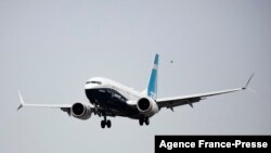 FILE - A Boeing 737 MAX airliner piloted by Federal Aviation Administration (FAA) Administrator Steve Dickson lands following an evaluation flight at Boeing Field the in Seattle, Washington, Sept. 30, 2020.