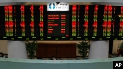 FILE - The display board of the Istanbul Stock Exchange in Istanbul, Turkey, is seen in a March 9, 2009, photo. 