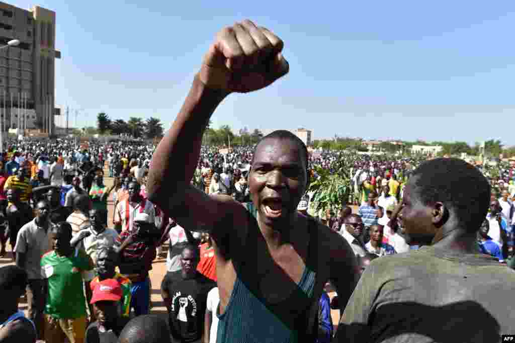 Demonstrators in Burkina Faso’s capital, Ouagadougou, protest plans to let President Blaise Compaoré extend his rule beyond 30 years. The demonstrators face tear gas fired by security forces.