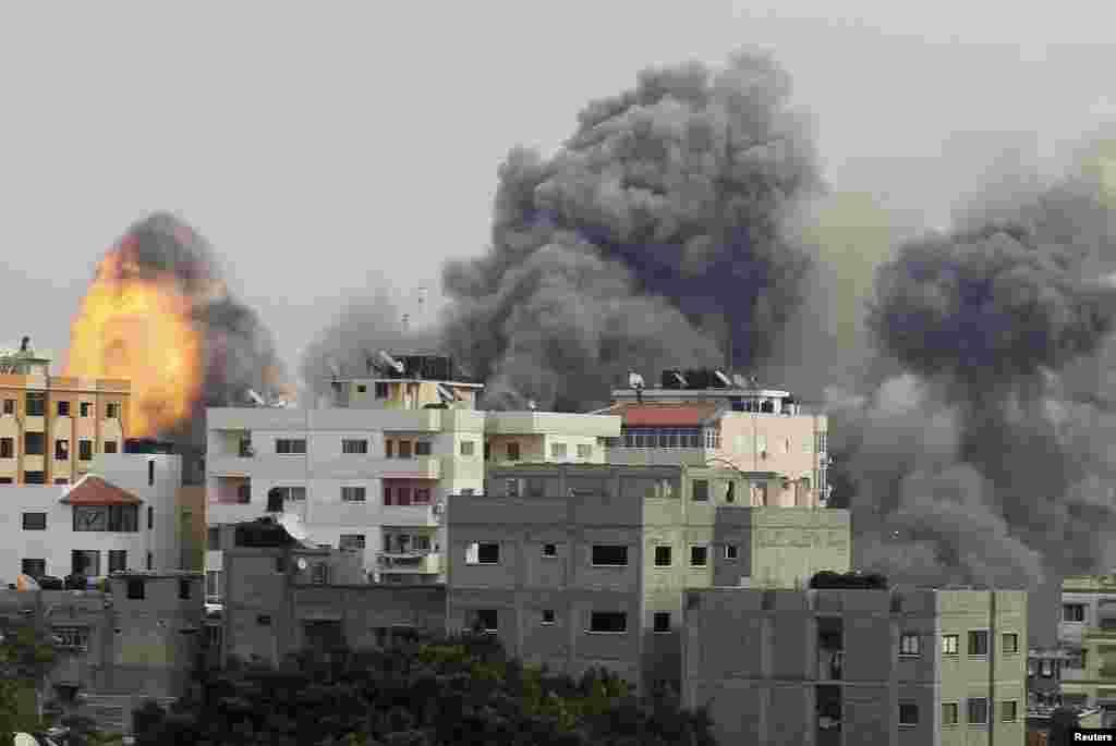 Smoke and explosion are seen after what witnesses said was an Israeli air strike in Gaza City November 21