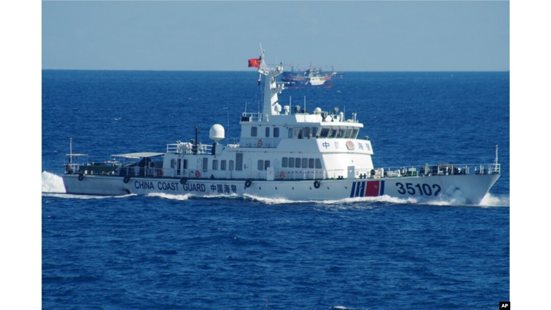In this photo released by the 11th Regional Coast Guard Headquarters of Japan, a Chinese coast guard vessel sails near disputed East China Sea islands, Aug. 6, 2016.