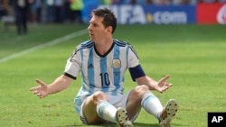 Argentina's Lionel Messi appeals for a foul during the World Cup quarterfinal soccer match between Argentina and Belgium at the Estadio Nacional in Brasilia, Brazil, Saturday, July 5, 2014. (AP Photo/Martin Meissner)