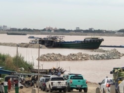 The reclamation site is located in Arey Ksat village of Kandal province, July, 4, 2021. Photos emerged on social media in recent days showing rocky outcrops along the river bank in Arey Ksat – right next to where the ferry docks and in front of villagers’ homes. (Sun Narin/VOA Khmer)