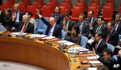 Ambassadors to the United Nations raise hands in a Security Council resolution vote to sanction North Korea at U.N. headquarters in New York, June 2, 2017.