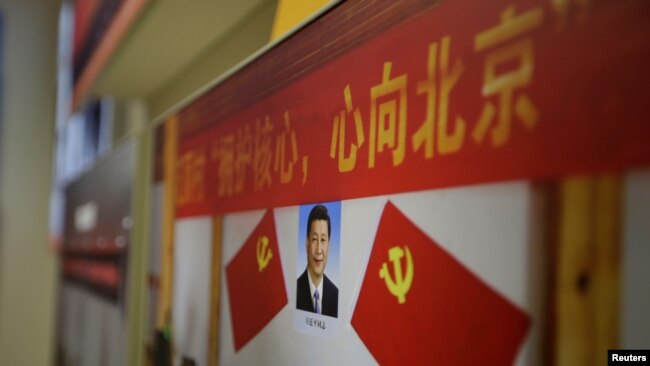 Chân dung Chủ tịch Trung Quốc Tập Cận Bình tại một cuộc triển lãm về thành tựu CNXH ở Bắc Kinh.