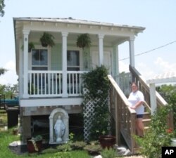 Cheryl Kring's rebuilt home in Waveland, Mississippi is one block from the beach. The elevated house is typical of the new landscape along the Mississippi Gulf Coast.
