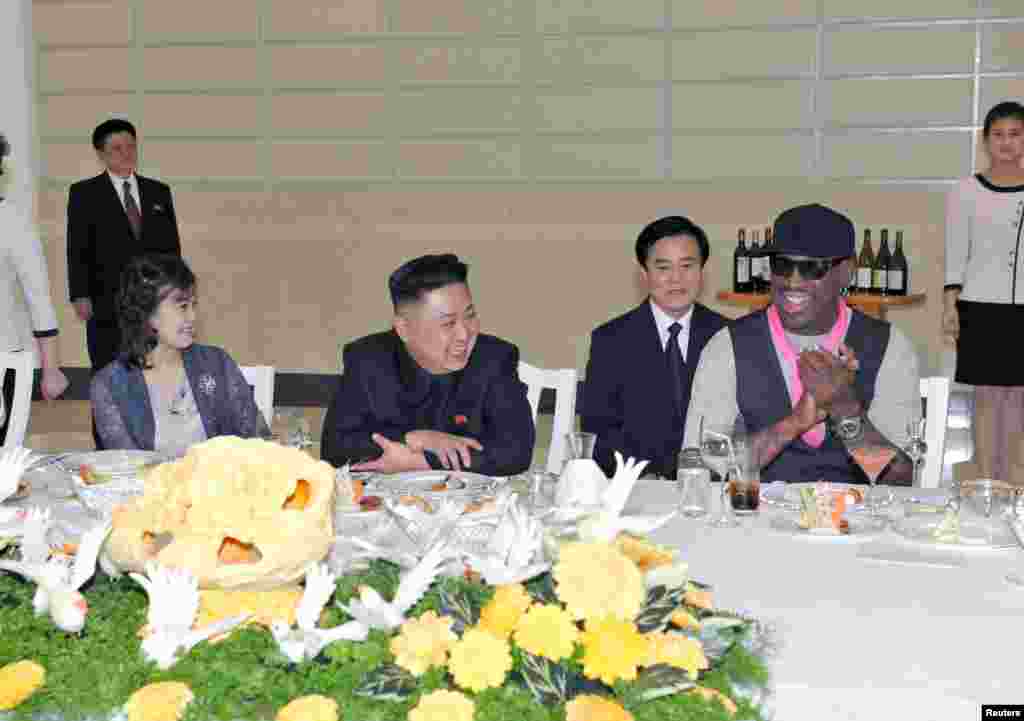 North Korean leader Kim Jong-Un (C), his wife Ri Sol-Ju (L) and former NBA basketball player Dennis Rodman (R) talk in Pyongyang in this undated picture released by North Korea'sKCNA news agency on March 1, 2013. KCNA reported that a mixed basketball game of visiting U.S. basketball players and North Korean players was held at Ryugyong Jong Ju Yong Gymnasium in Pyongyang on February 28, 2013.