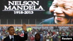 President Barack Obama addresses the crowd during a memorial service for Nelson Mandela at FNB Stadium in Johannesburg, South Africa, Dec. 10, 2013. 