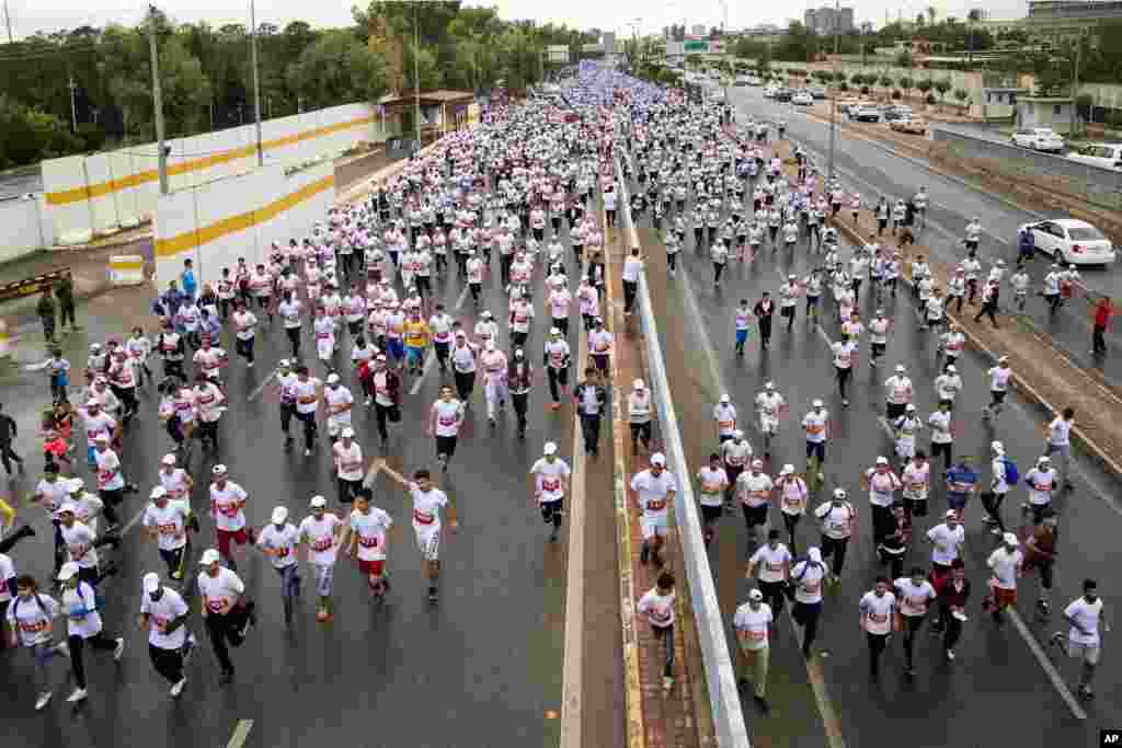 Runners compete in an annual international marathon for peace in Irbil, northern Iraq. The marathon started in 2011 and is organized by the Irbil running club.
