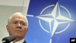 U.S. Defense Secretary Gates holds a news conference at a NATO defense ministers meeting at the Alliance headquarters in Brussels, March 10, 2011