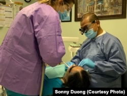 Dr. Sonny Duong, treats a patient in his dental office at the Community Health Center in Fredericksburg, VA.