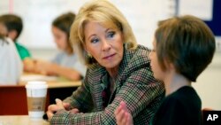 FILE - Education Secretary Betsy DeVos visits a classroom at the Edward Hynes Charter School in New Orleans, Oct. 5, 2018. 