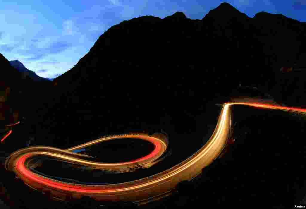 A long exposure shows traffic flowing on the Gotthardstrasse mountain pass road through the Schoellenenschlucht canyon near the village of Goeschenen, Switzerland.