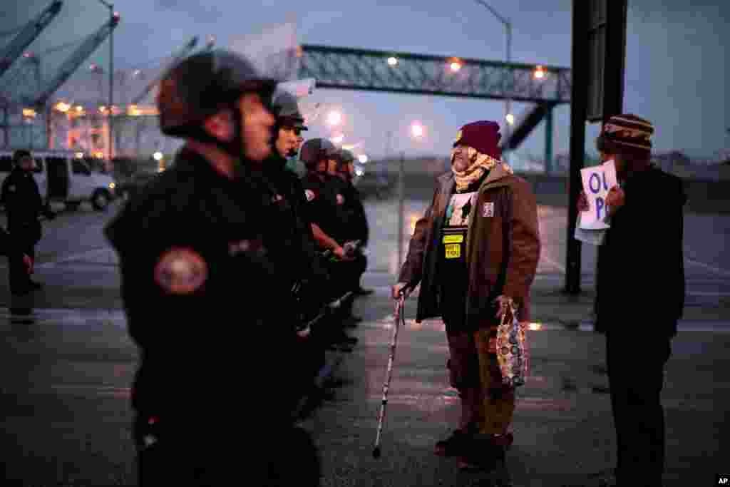 Dec. 12: A protester faces a line of riot police in Long Beach, California. (Reuters)
