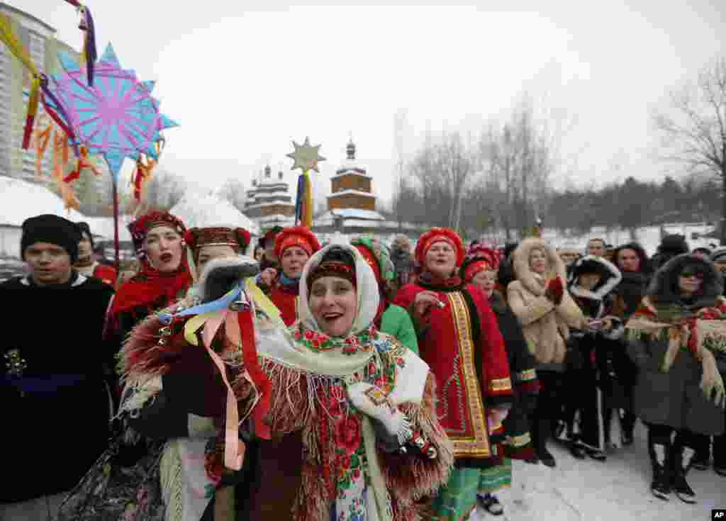 Ukrainians wearing traditional costumes sing Kolyadky or Ukrainian Christmas Carols, as a part of Orthodox Christmas in Kyiv.