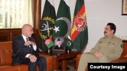 Afghan President Ashraf Ghani, left, meets with Pakistani General Raheel Sharif at army headquarters in Rawalpindi, Pakistan, Nov. 14, 2014. (Photo courtesy of Pakistani army)