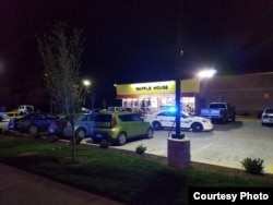 A police car is seen outside a Waffle House restaurant in Nashville, Tennesee, where three people were killed, 22 April, 2018, a a fourth person later died from injuries sustained in the shooting (Courtesy: Metropolitan Nashville Police Department)