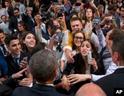 President Barack Obama shakes hands after speaking at a town hall meeting with local Argentinians at the Usina del Arte, in Buenos Aires, Argentina, March 23, 2016.
