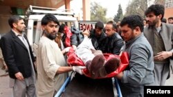A wounded Afghan man arrives at a hospital in Jalalabad after a suicide attack that targeted funeral-goers in Laghman province, Afghanistan, Jan. 29, 2015. (REUTERS/ Parwiz)