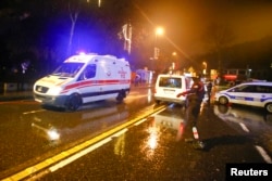 An ambulance arrives near a nightclub where a gun attack took place during a New Year's party in Istanbul, Turkey, Jan. 1, 2017.